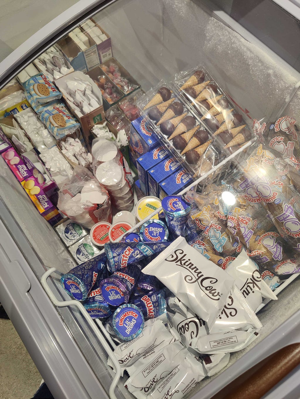 a freezer full of a variety of ice cream types