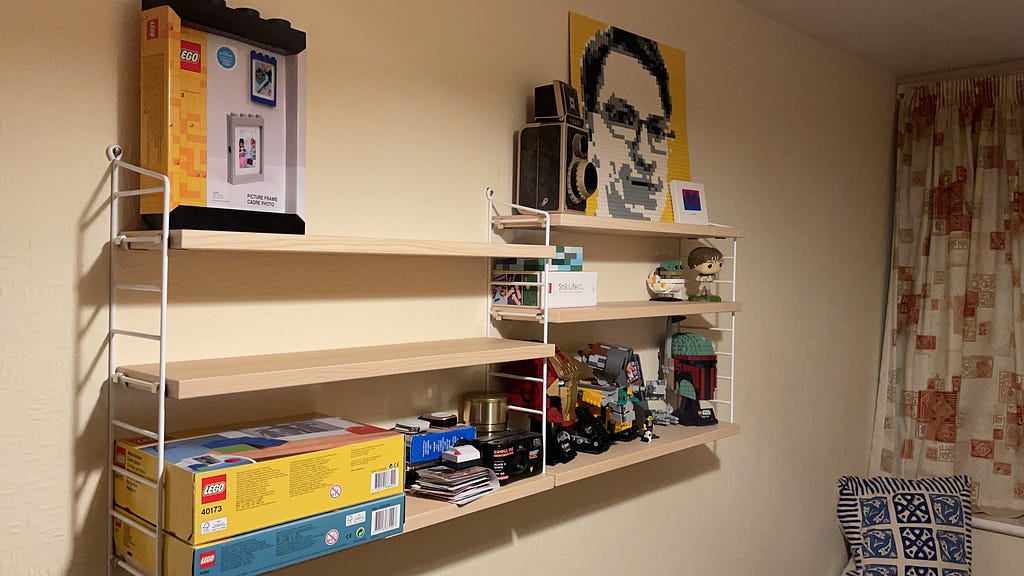 Shelving on the well opposite from my desk — the “LEGO shelves”