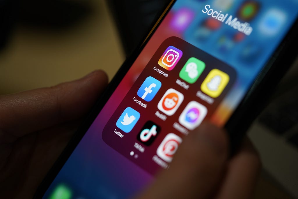 Closeup of phone screen showing social media app icons. Photo by P. Kijsanayothin/Getty Images