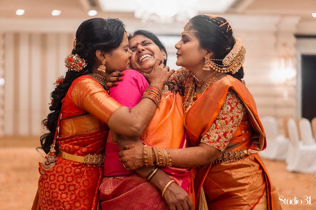 Emotional candid wedding moment by Studio 31 at Leela Palace, Chennai