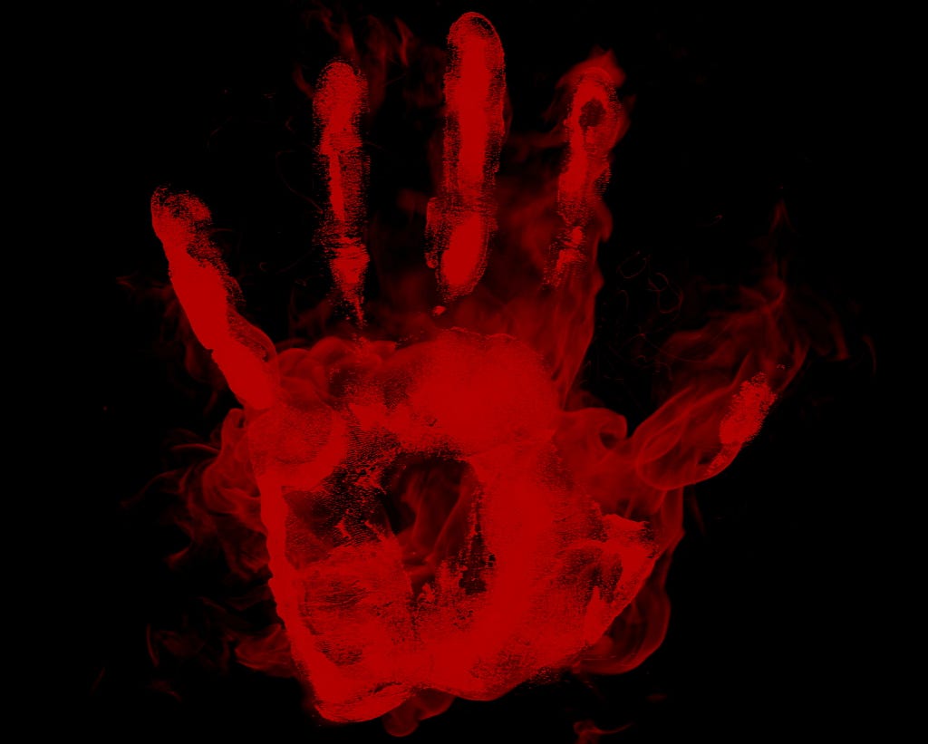 A black background with a red handprint.