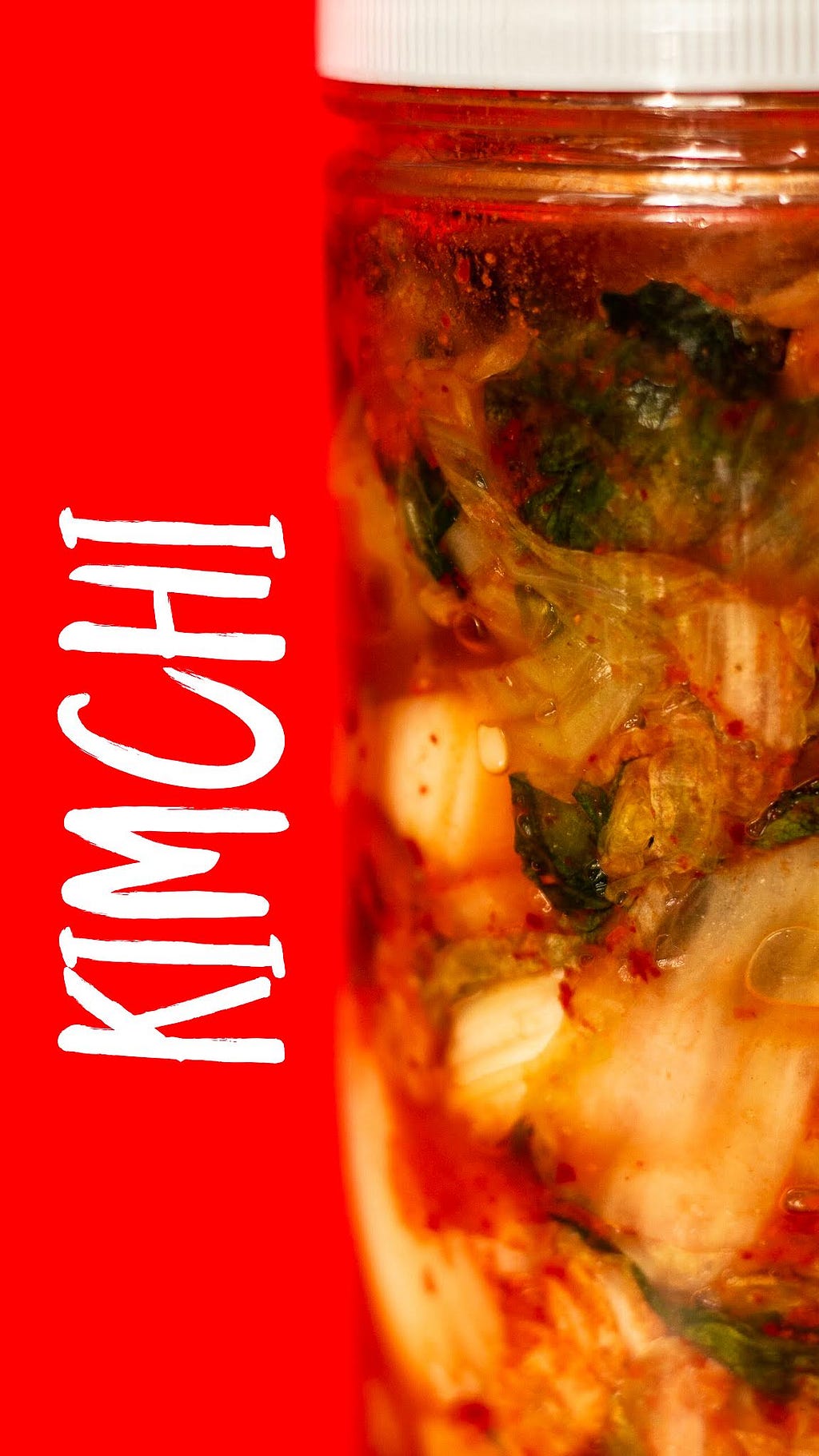 Kimchi in jar with a red background. White text on the side that says Kimchi