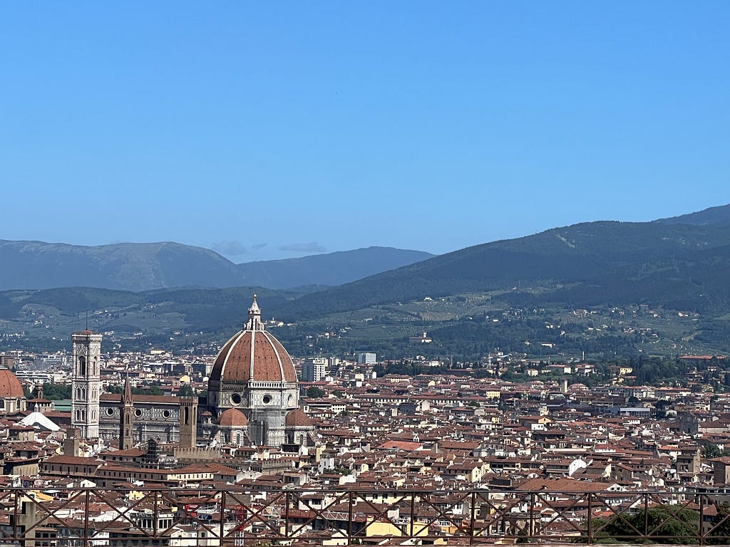 The city of Florence, seen from the heights across the Arno River.