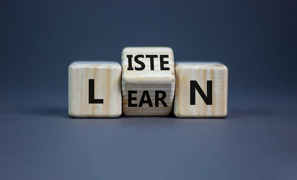 Listen and learn symbol. Turned a wooden cube and changed the word ‘listen’ to ‘learn’.