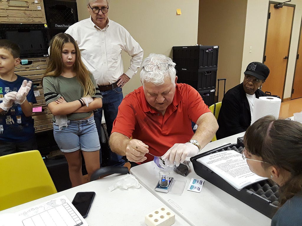 David Gauthe testing a soil sample to identify oil and other contaminants. Photo by Dan Copp/The Daily Comet