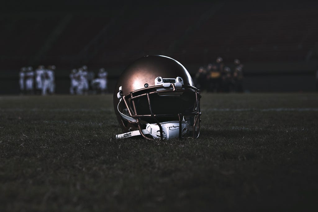 Image of a helmet and safety equipment to safeguard oneself during sports — similar to crucial leadership lessons to take note of when starting to lead a new team