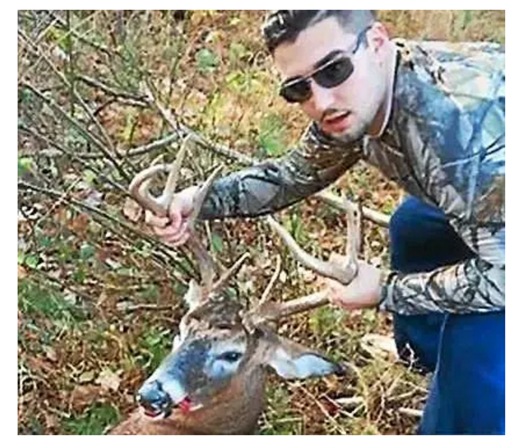 Cosmo DiNardo posing with a deer he shot