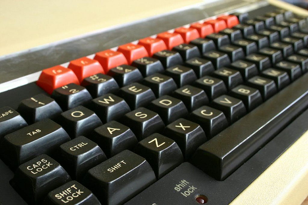 A picture of a computer from the 1980s — looks like an old-fashioned typewriter keyboard with no screen (you used a TV!)