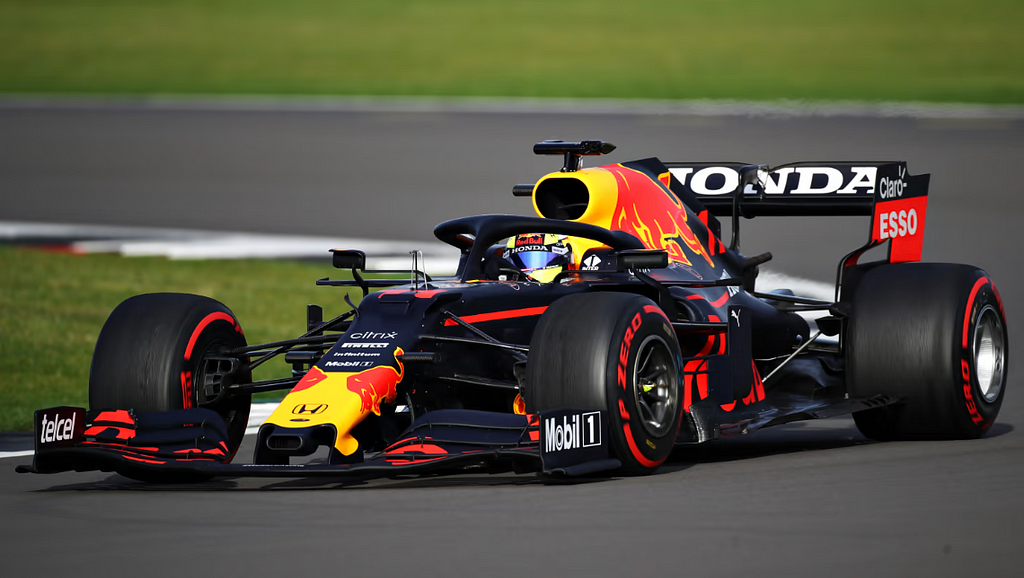 Image of Sergio Perez driving a Red Bull Formula One car.