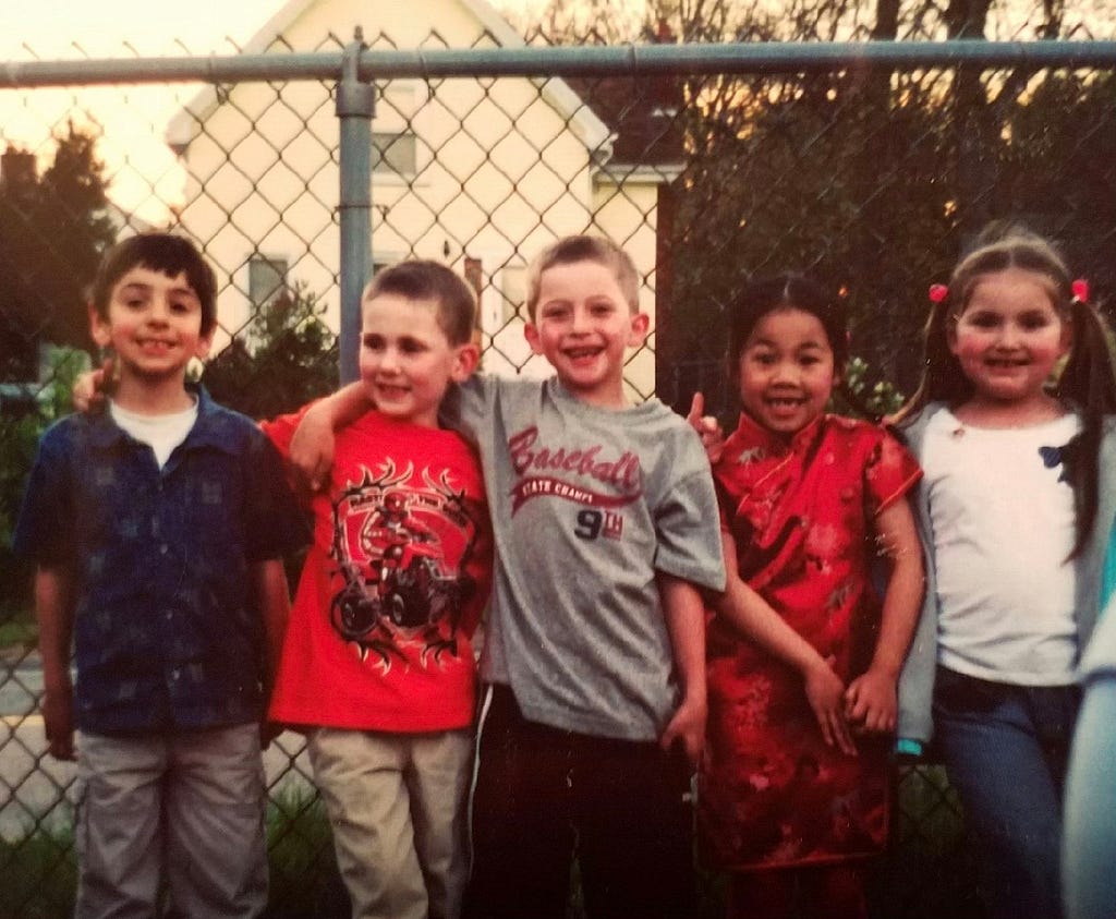 Pictured: Childhood friends from kindergarten. From left to right, I’m the fourth person, wearing a traditional Chinese qipao.