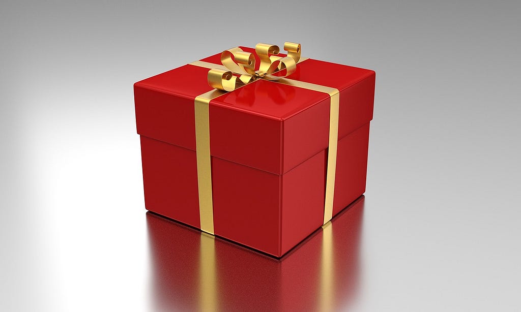 A gift wrapped in wrapping paper to signify buying gifts on Cyber Monday.