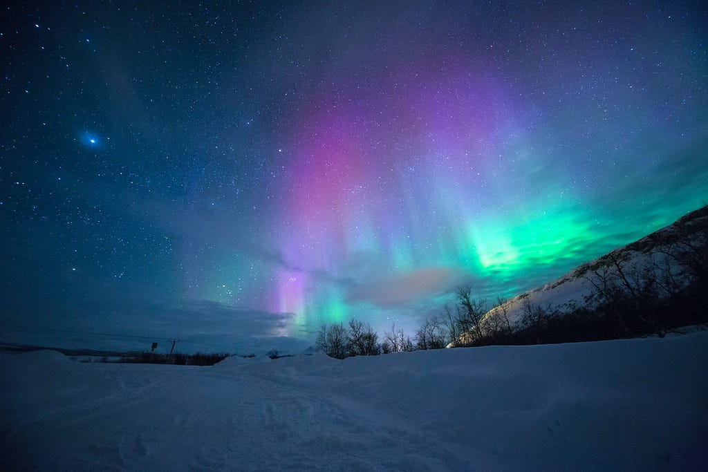 The Aurora Borealis. Tromse, Norway. Image from Lightscape via Unsplash