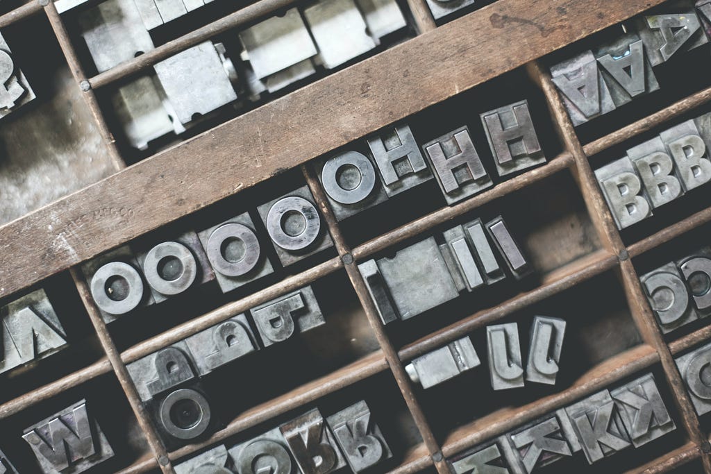 Sorted letterpress keys in a tray, ready to be used