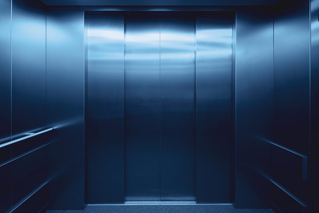 An empty lift with the doors closed.