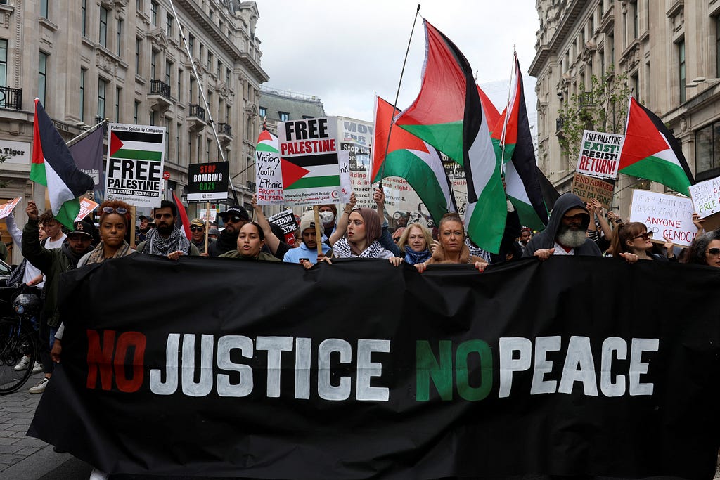 London March with protesters holding a ‘NO JUSTICE, NO PEACE’ sign