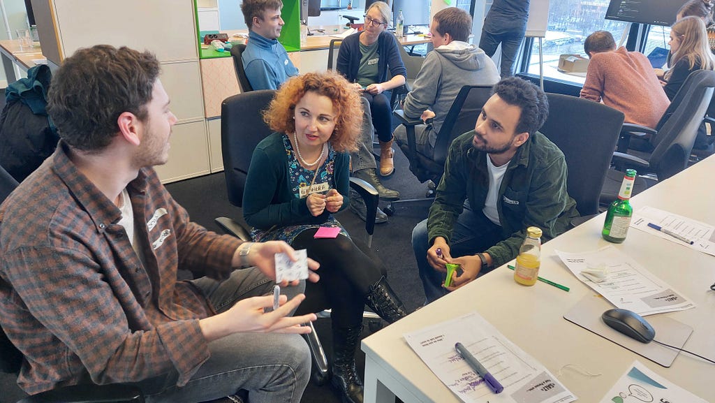 A team sitting in a circle together, discussing an important topic.