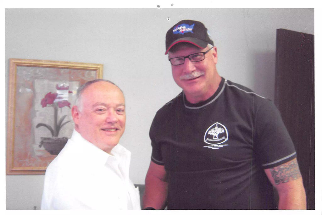 Dr. Joe Diruzzo with former Dallas Cowboy Randy White