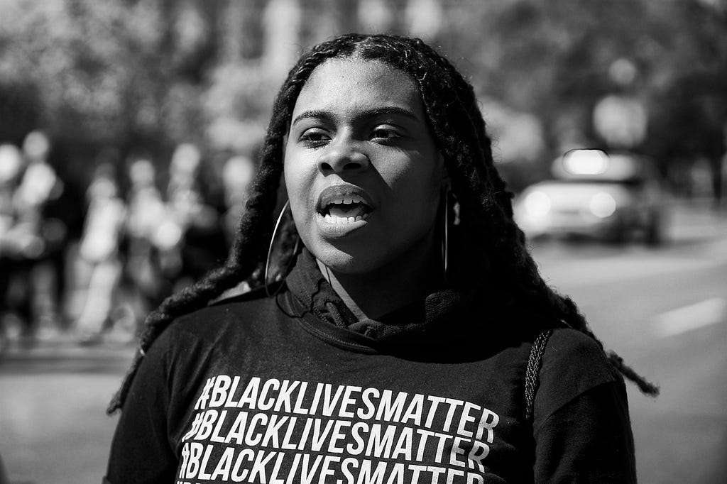 Photo of woman at Black Lives Matter protest by Miki Jourdan