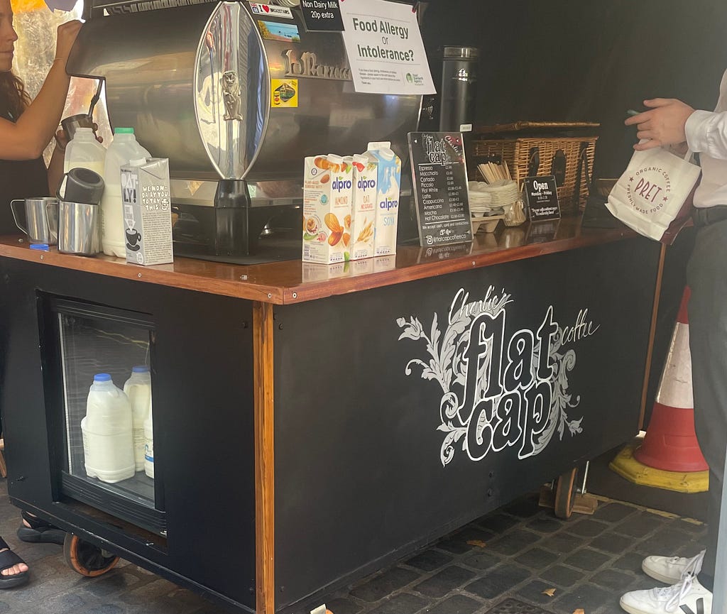 An image of Charlie’s flat cap coffee stand
