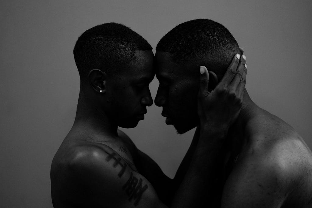 A white and black picture of black gay couple gotten from Pexel, shot by Joshua Mcknight