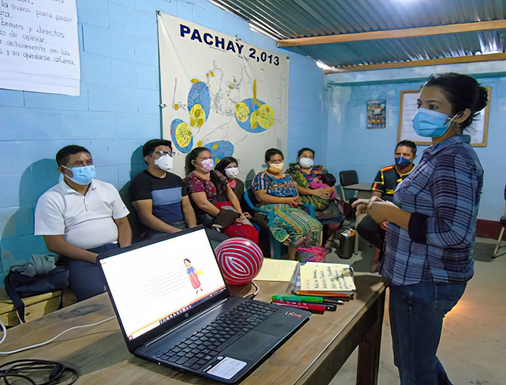 A woman making a presentation to the community in Pachay, Chimalttenango, Guatemala