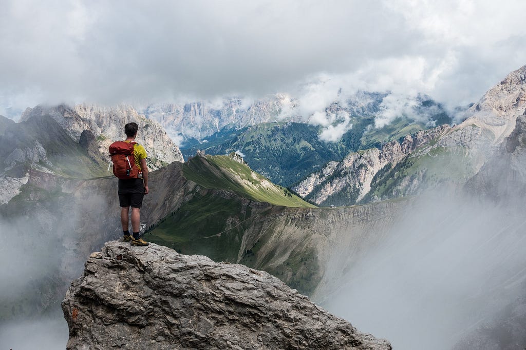 Man looking out over the distant mountains