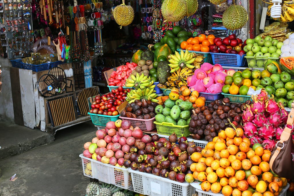 Jackfruit and other colorful fruits and vegetables in Indonesian market