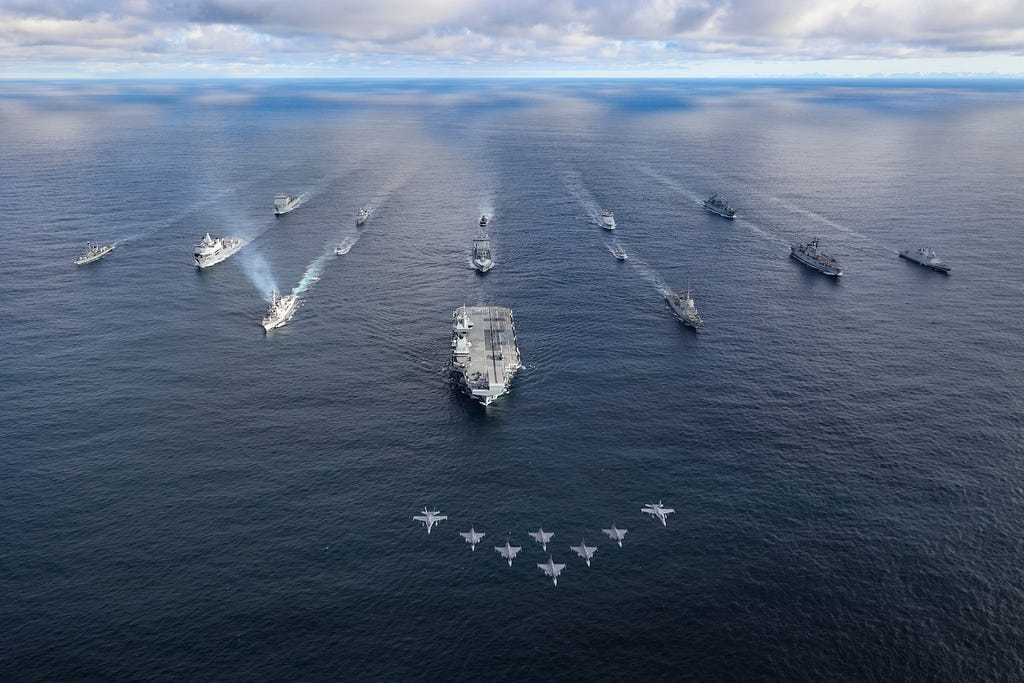 The Royal Navy aircraft carrier HMS Prince of Wales leads a fifteen-ship formation of ships from the United Kingdom Carrier Strike Group and the NATO Amphibious Task Group during Exercise Nordic Response 24 in the Norwegian Sea, March 11, 2024. Photo by Belinda Alker/Royal Navy