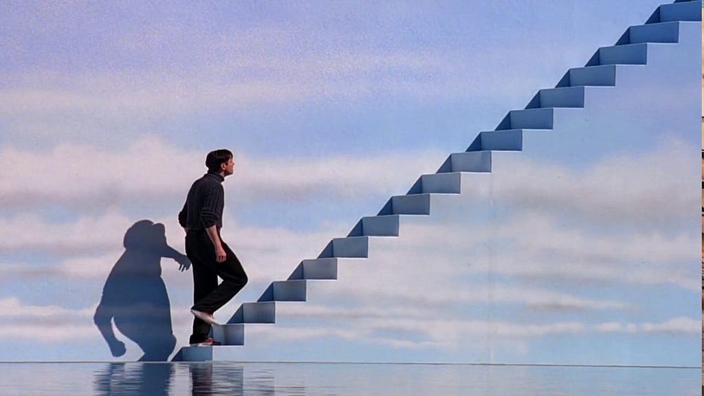 A still from the movie The Truman Show (1998) starring Jim Carrey walking up stairs that are painted like the sky.