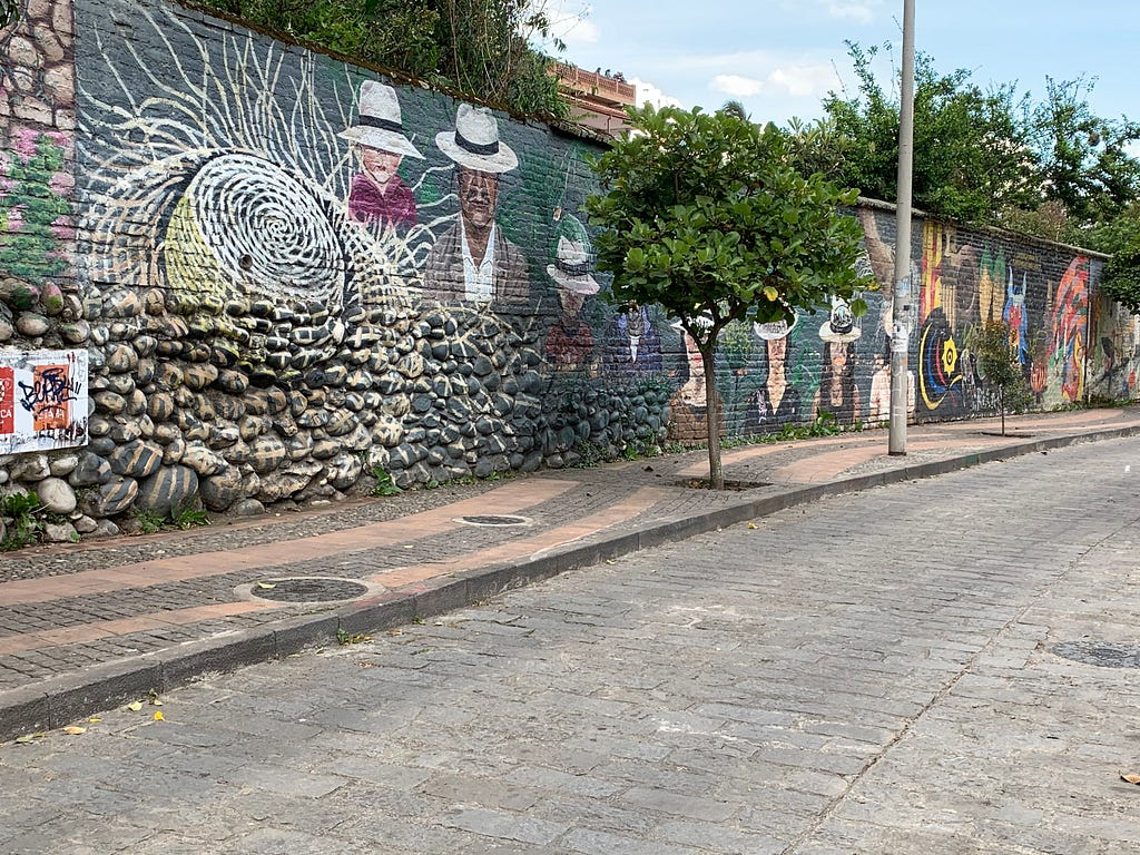 One of the many murals in the City of Cuenca. Six citizens of Cuenca are painted wearing the famous white Panama Hats.