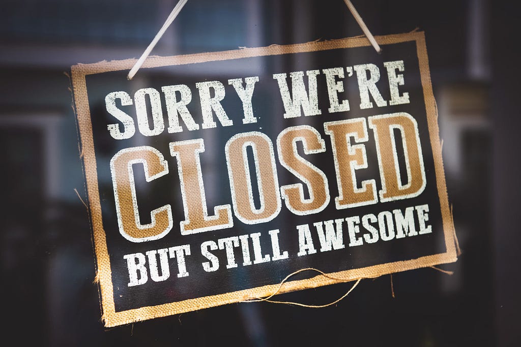 Image of a store sign with the phrase: “Sorry we’re closed but still awesome.”