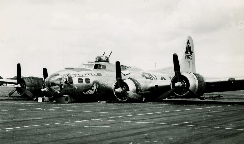 Crashed B-17 on runway.