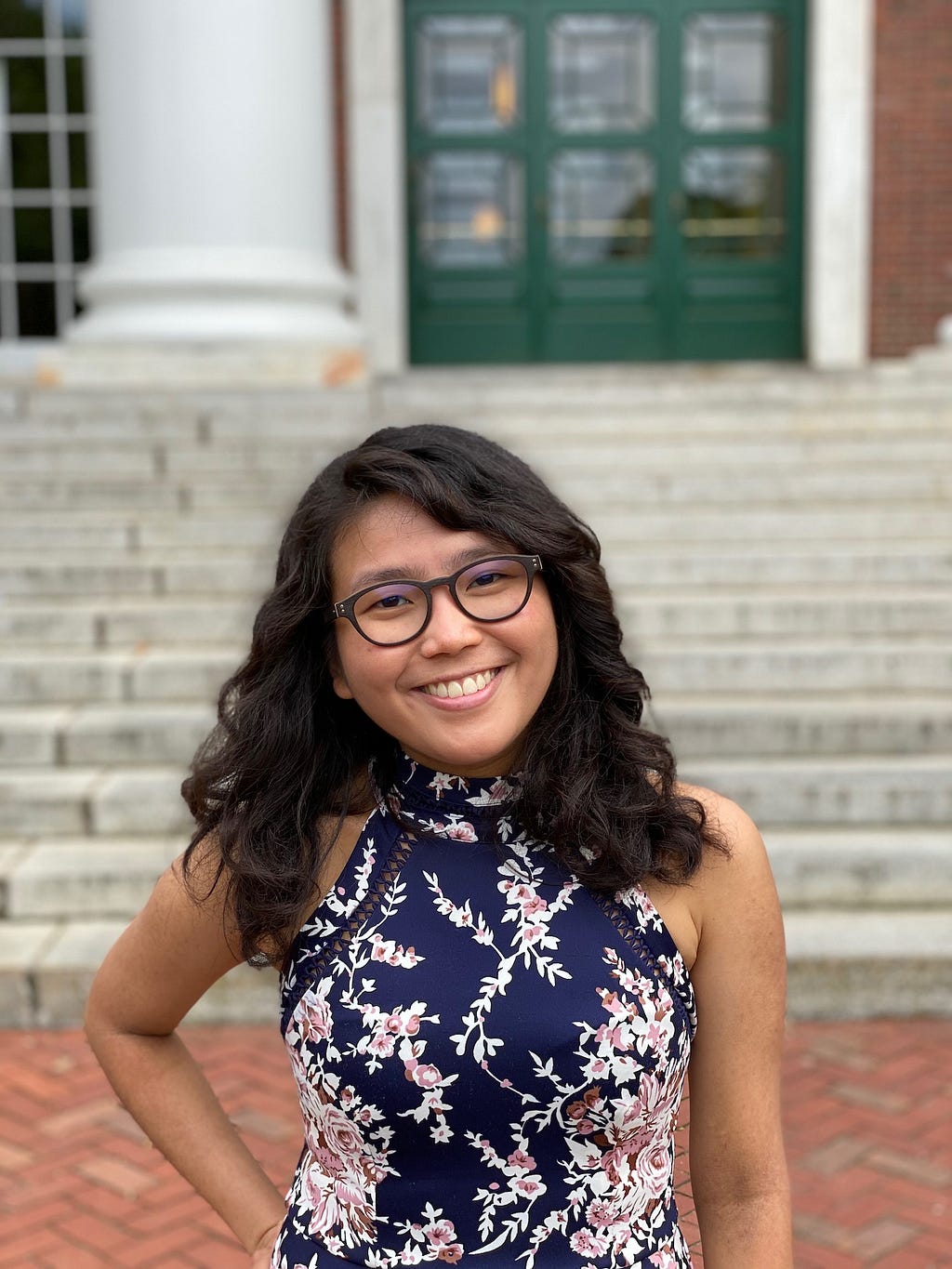 Isabel Yap, author of Never Have I Ever, standing in front of a building at Harvard.
