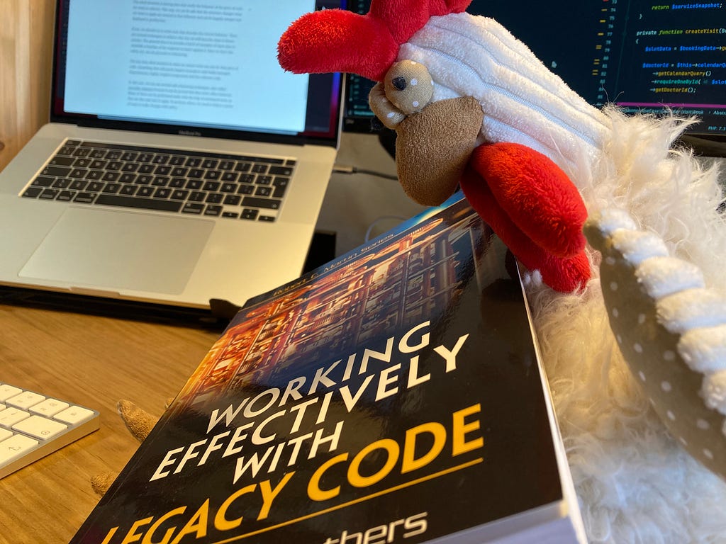 Hen developer with a book about working with legacy code