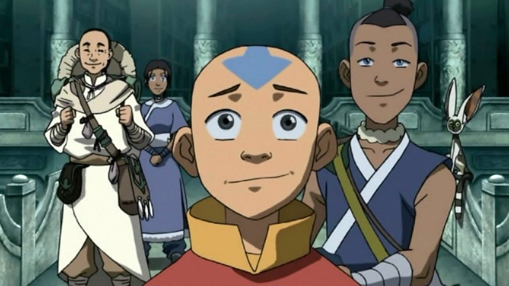 We see Aang, Katara, Sokka, and Momo facing the camera while smiling in ‘Avatar: The Last Airbender’.