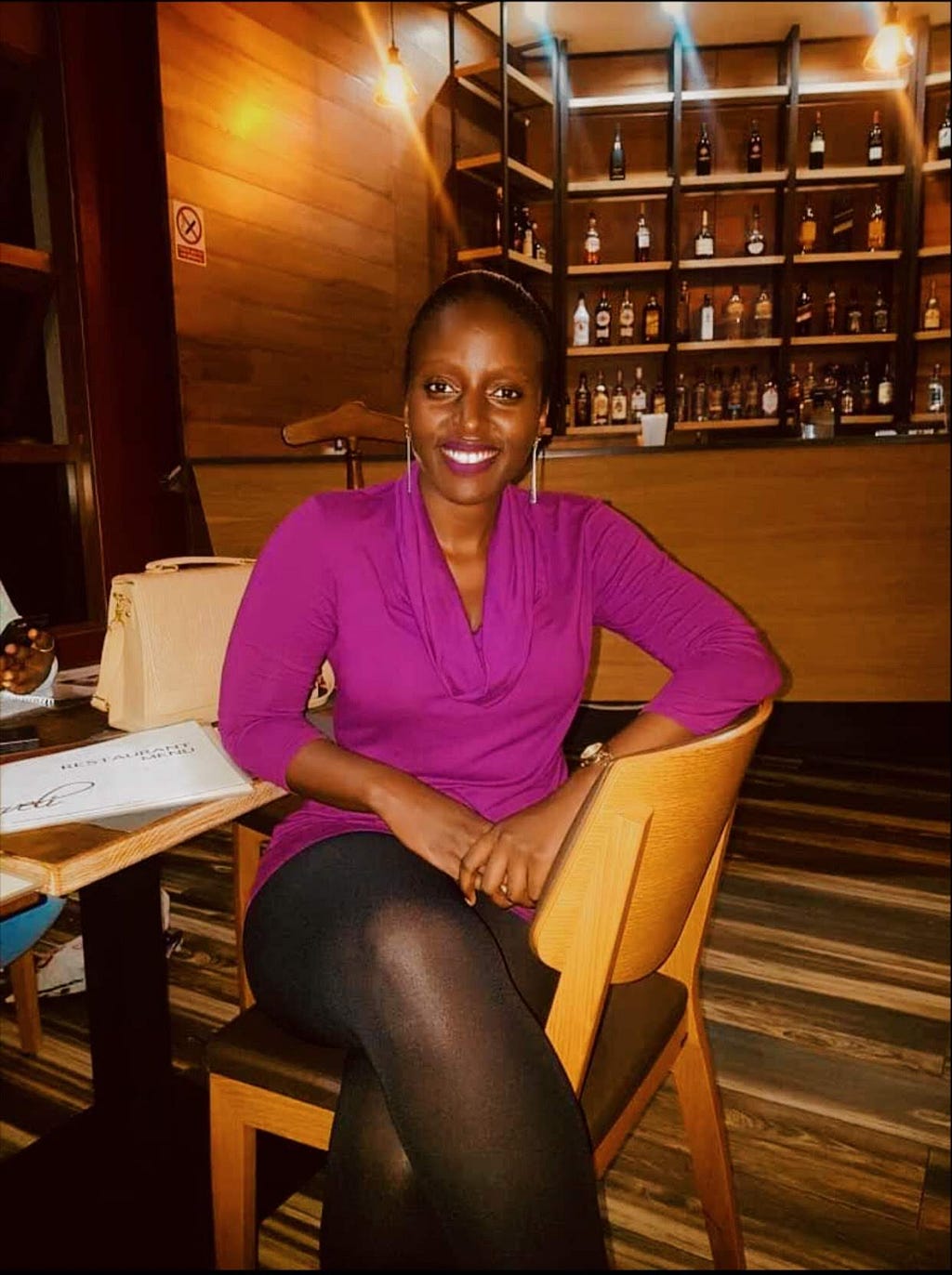 Michelle Muhumuza at one of the high end restaurants where she usually hangs out