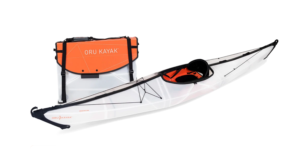 A photo of an Oru Kayak in folded and expanded form.