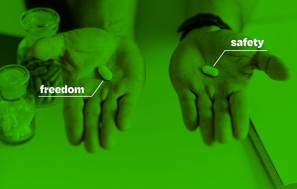 Two hands with pills, one has pill has a caption “safety”, second one “freedom”