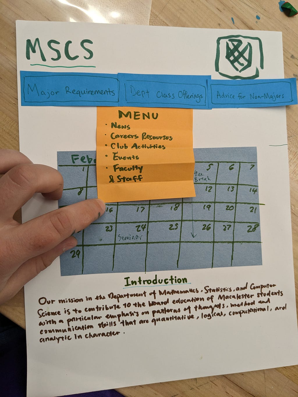 Paper prototype home page with events and menu dropdown.