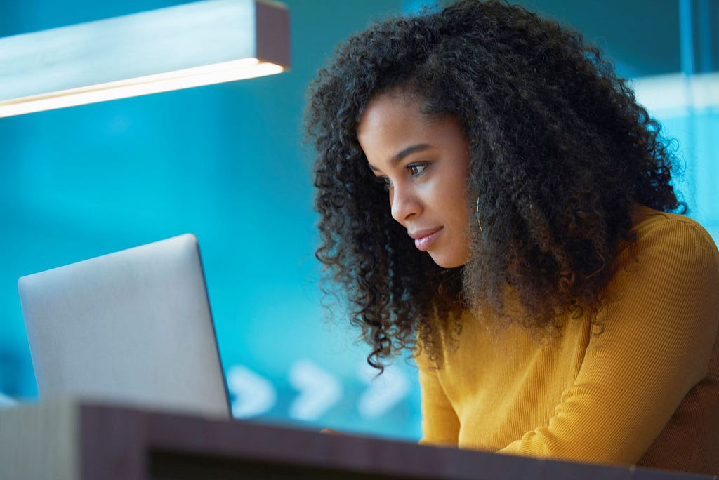 Woman looking at her laptop