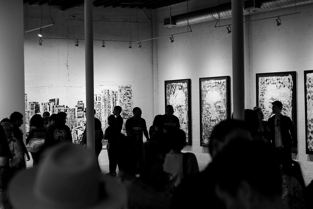 Black and white photo of art gallery and silhouettes