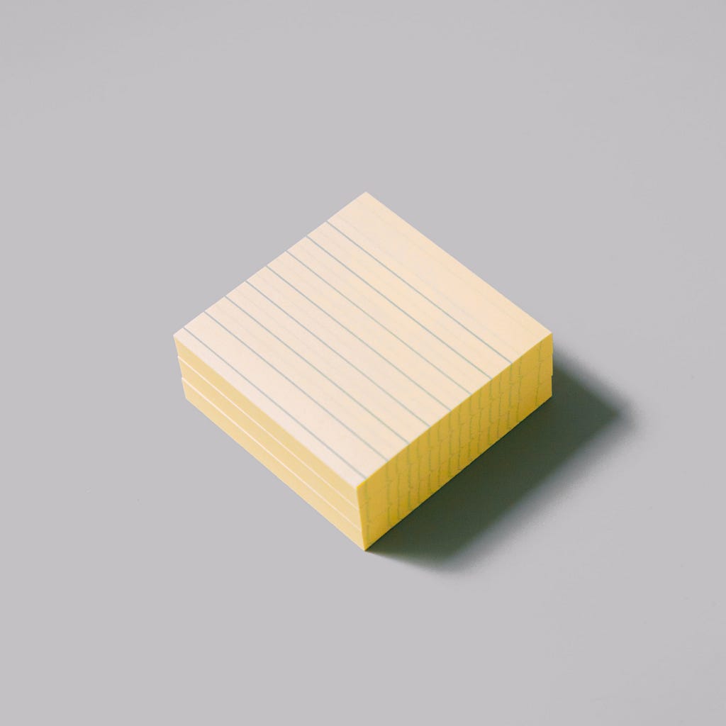 Stack of yellow lined sticky notes