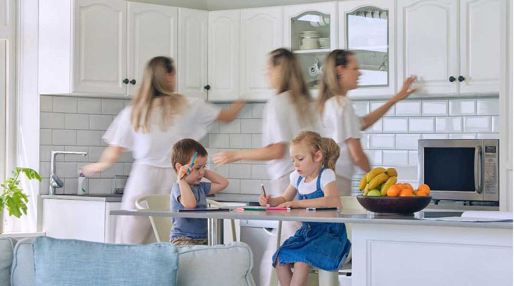 Mom busy in kitchen while kids do homework