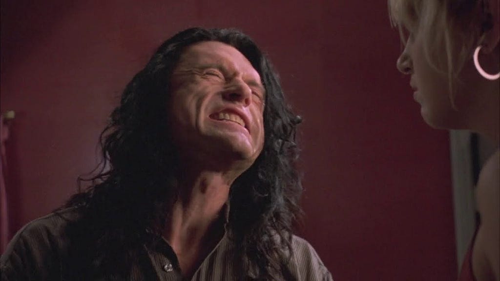 Picture of Tommy Wiseau from the movie “Room” getting angry