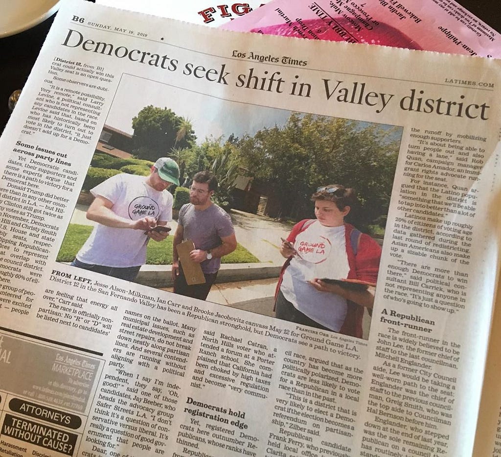 Ground Game team members on the cover of the LA Times while canvassing for Dr. Loraine Lundquist