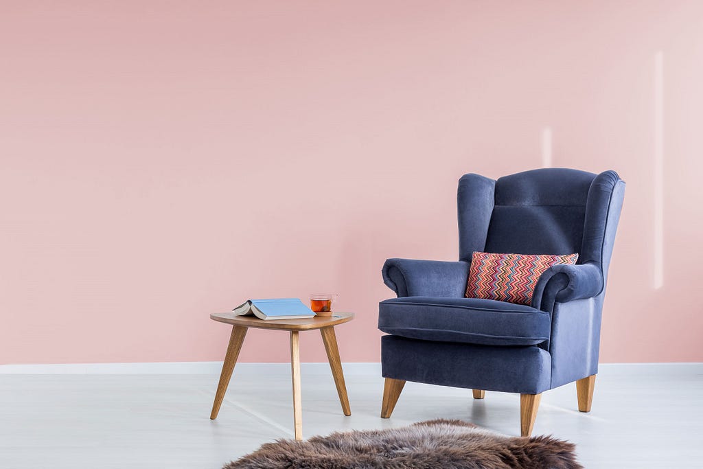 Empty chair with open book on table