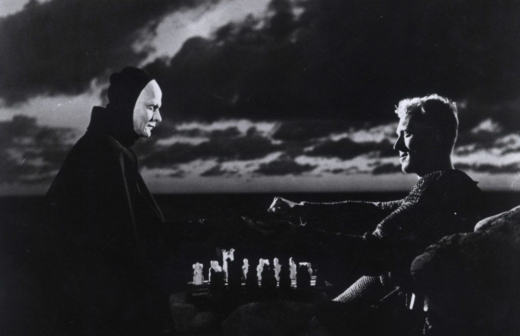 Still picture from The Seventh Seal by Ingmar Bergman. Shows Max Von Sydow playing chess with the personification of death played by Bengt Ekerot.