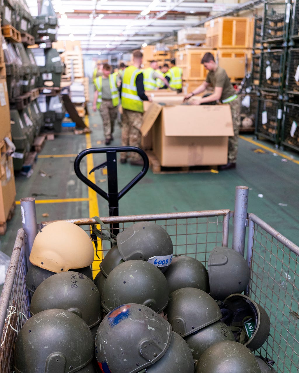 Close up of British Army helmets inside a metal crate