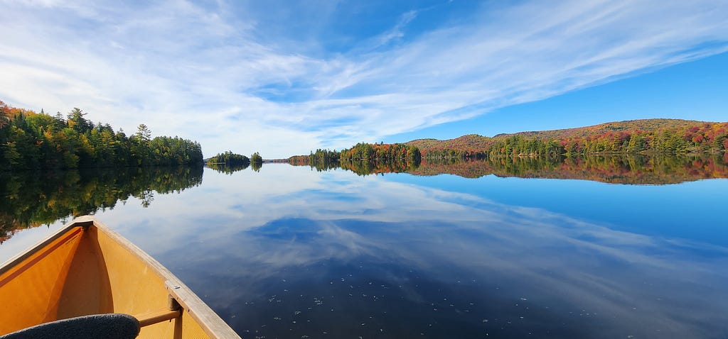 Lows lake calm day autumn colors captured by Author.