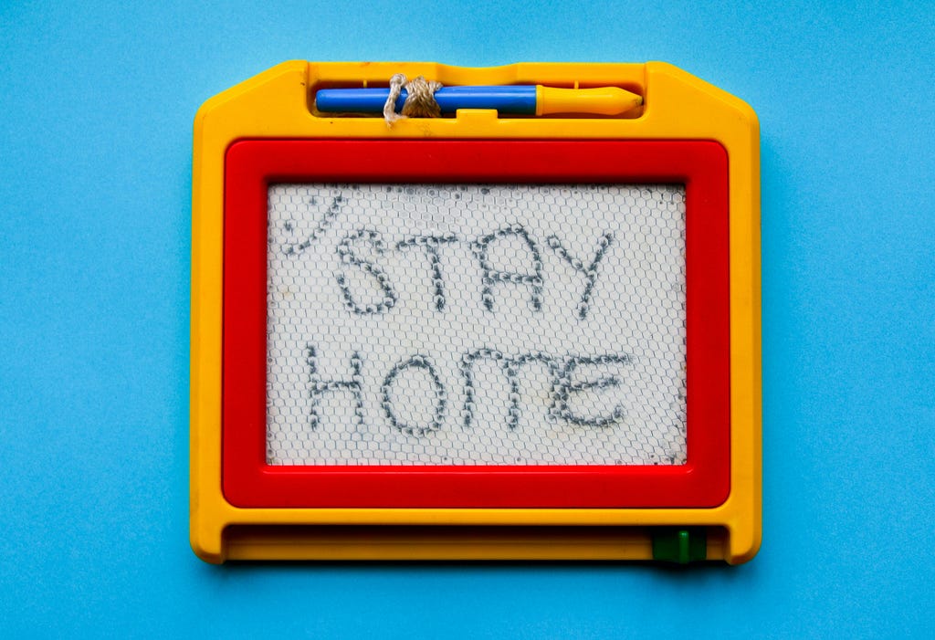 Child’s magnetic board showing ‘Stay Home’